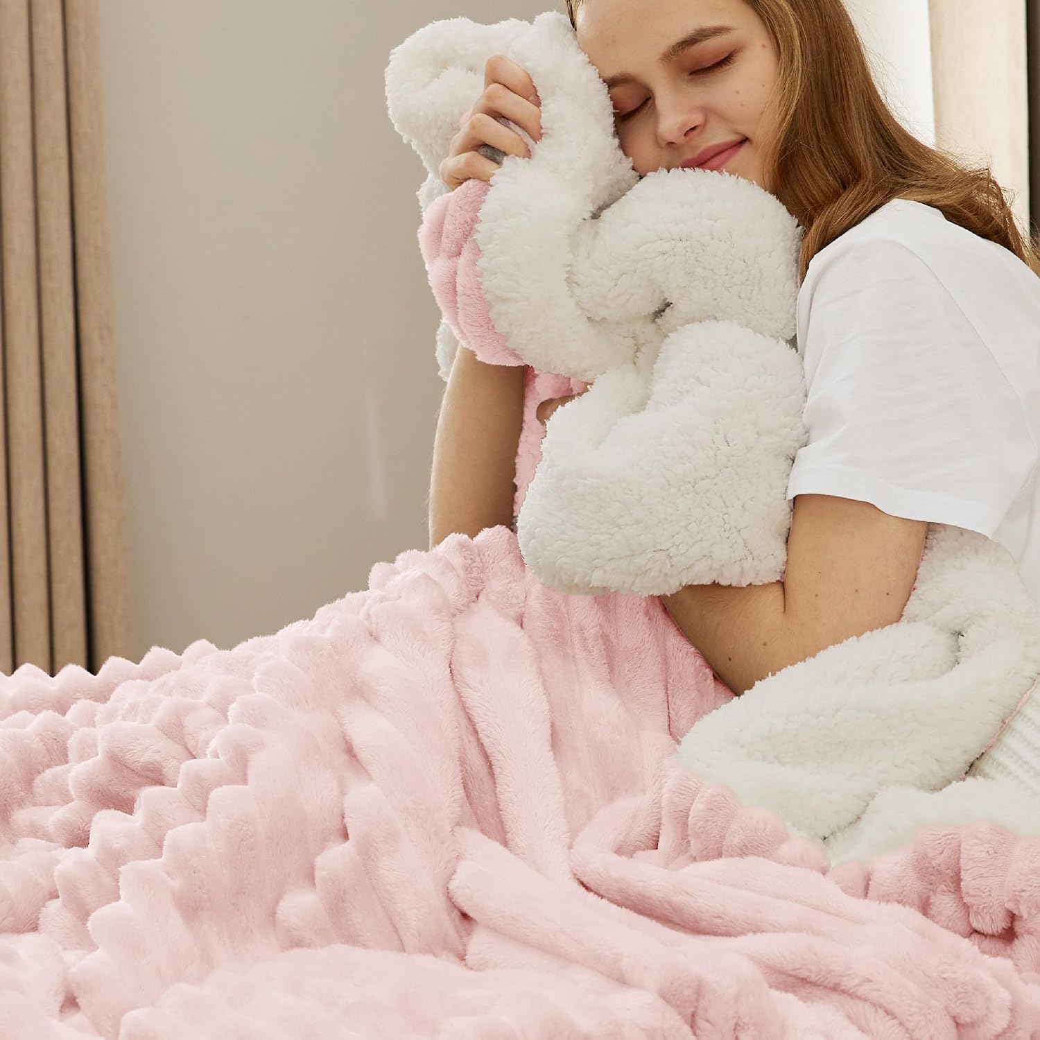 Soft pink fleece throw folded neatly