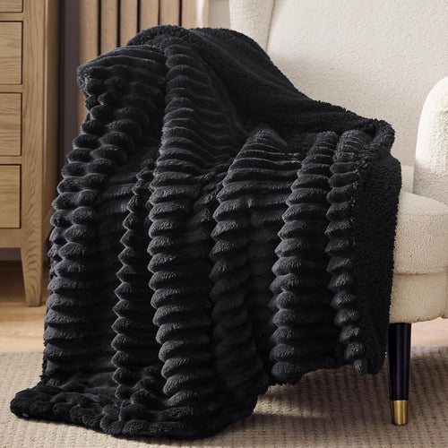 Verenza black sherpa throw blanket on couch
