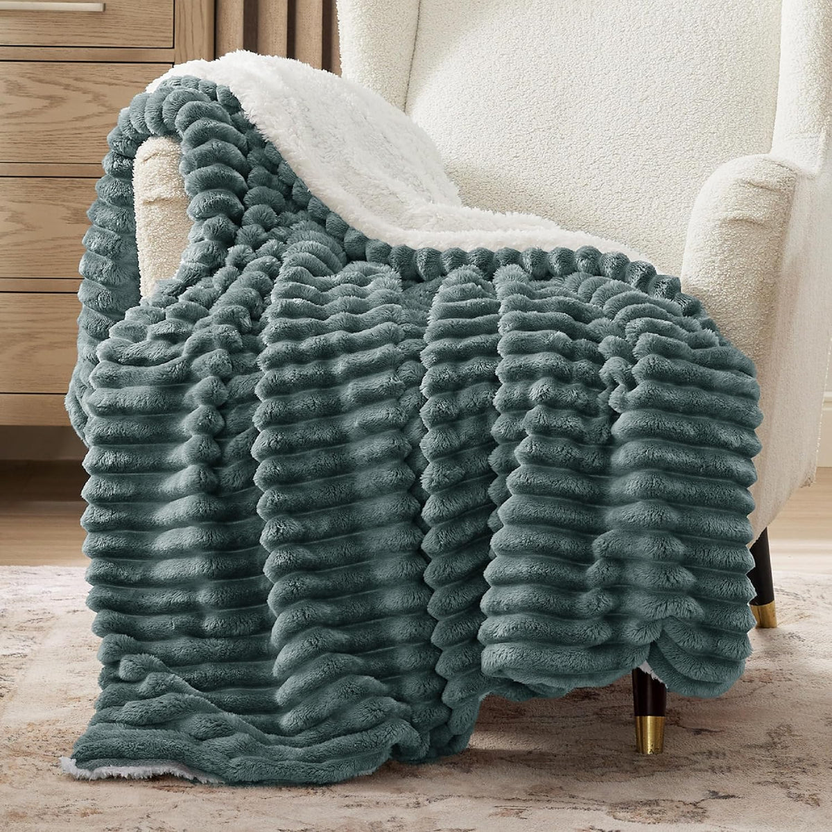 Verenza dark green sherpa throw blanket on sofa
