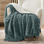 Verenza dark green sherpa throw blanket on sofa