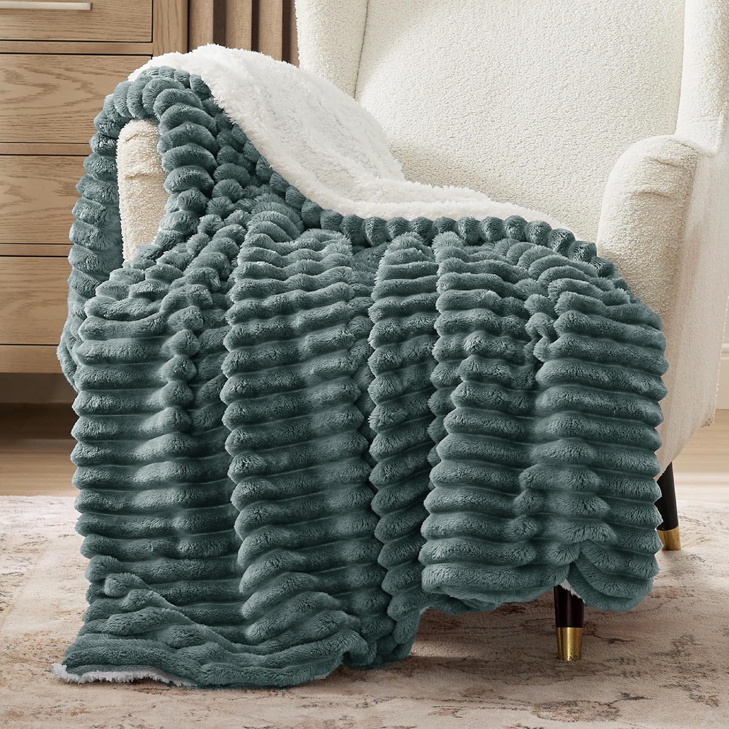 Verenza dark green sherpa throw blanket on sofa