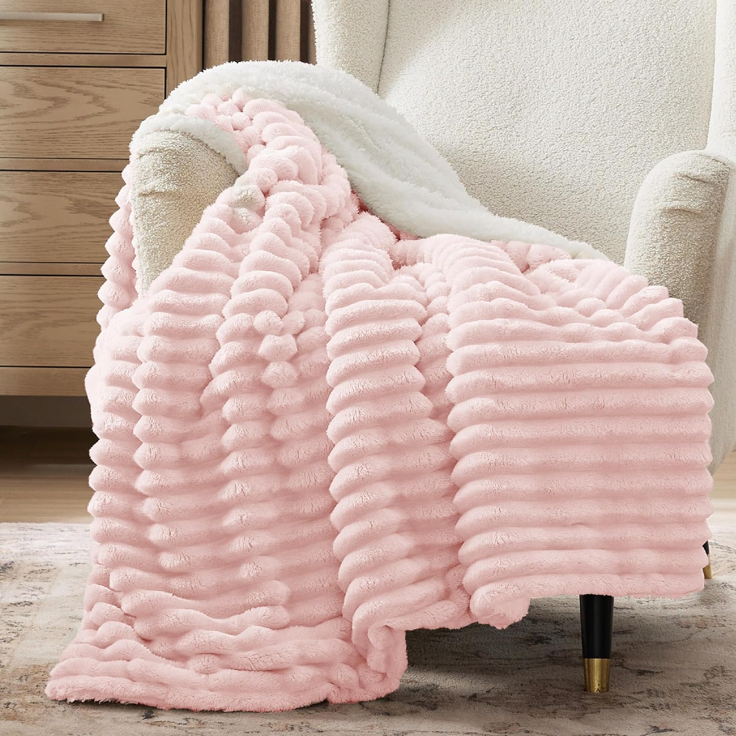 Verenza pink sherpa throw blanket on couch