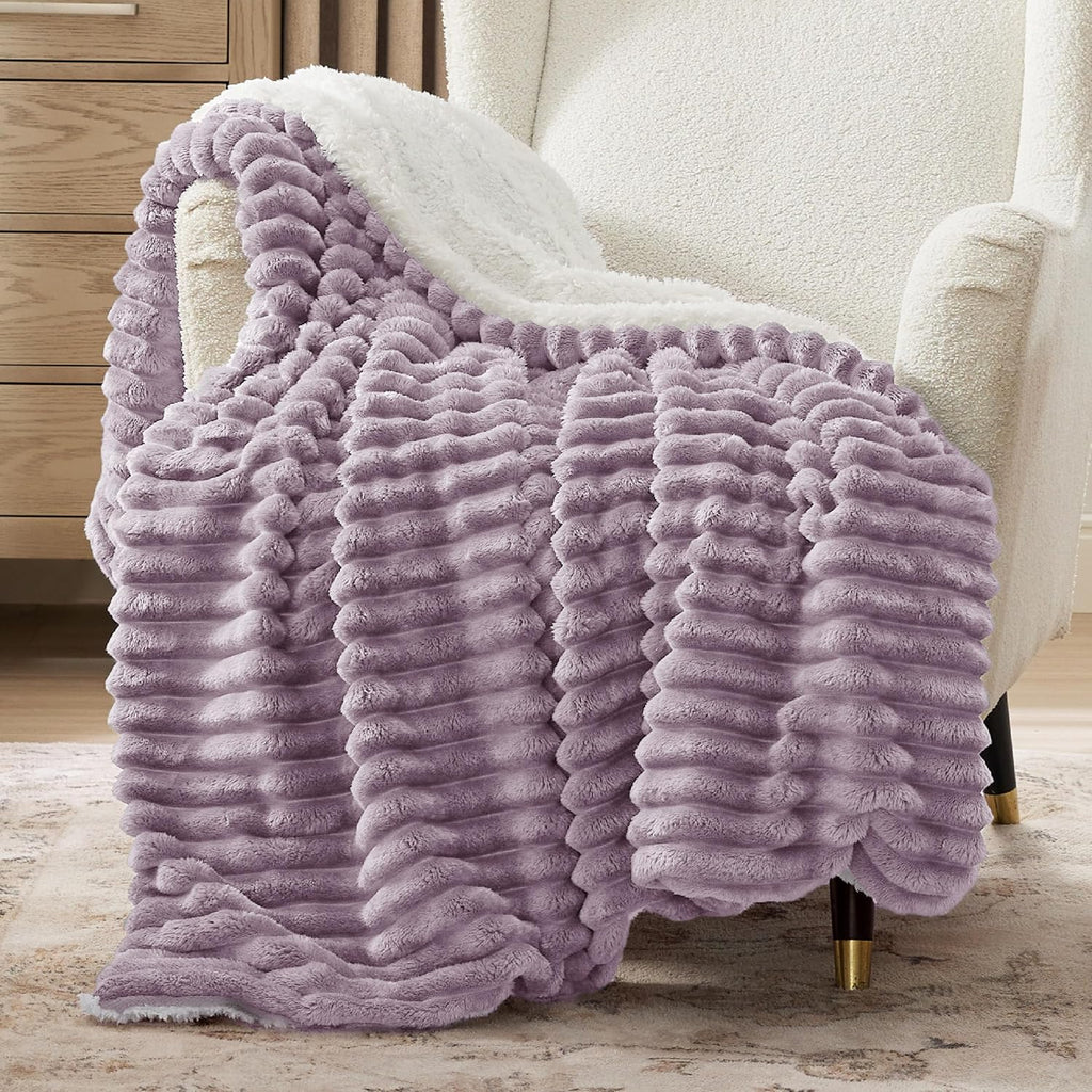 Verenza purple sherpa throw blanket on sofa