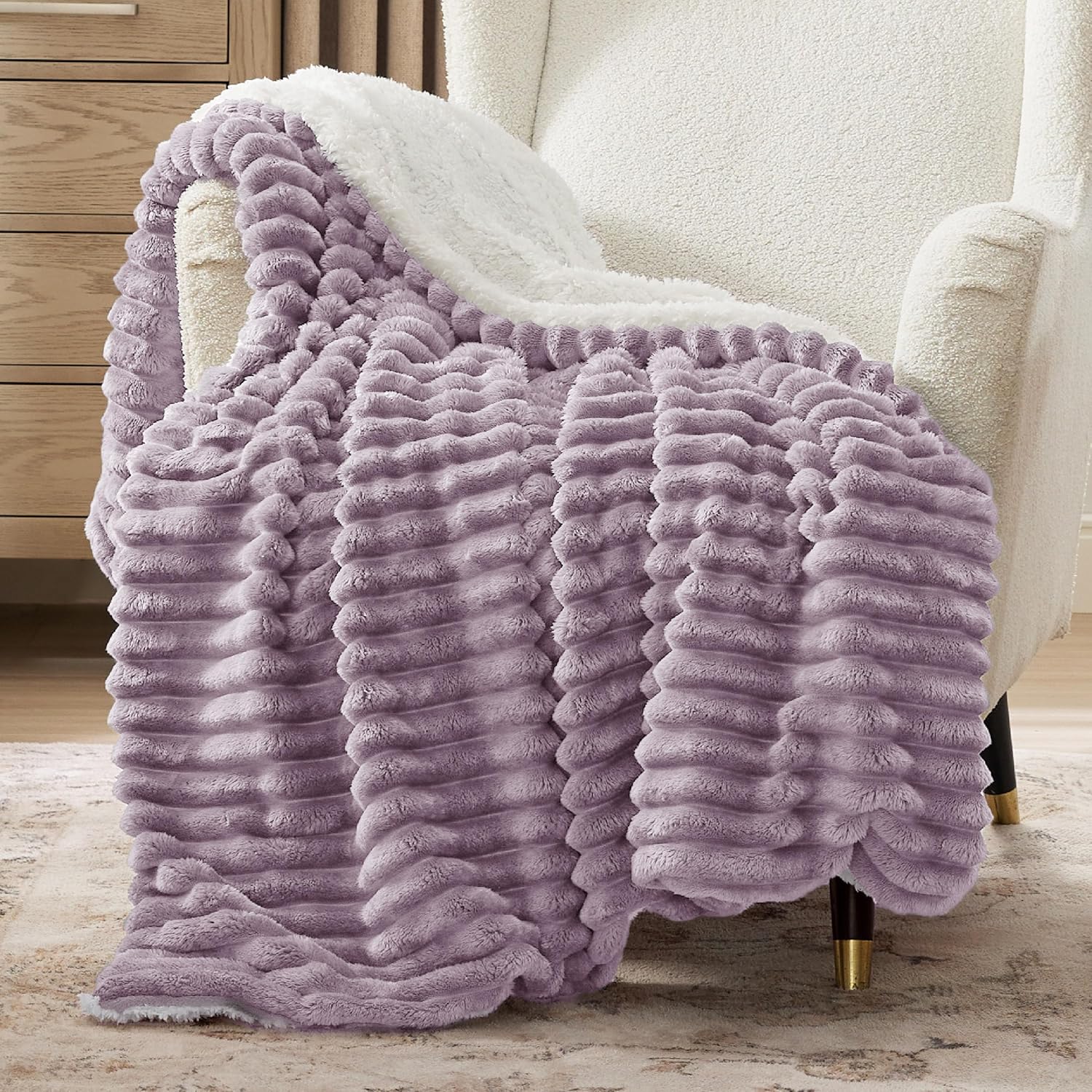 Verenza purple sherpa throw blanket on sofa