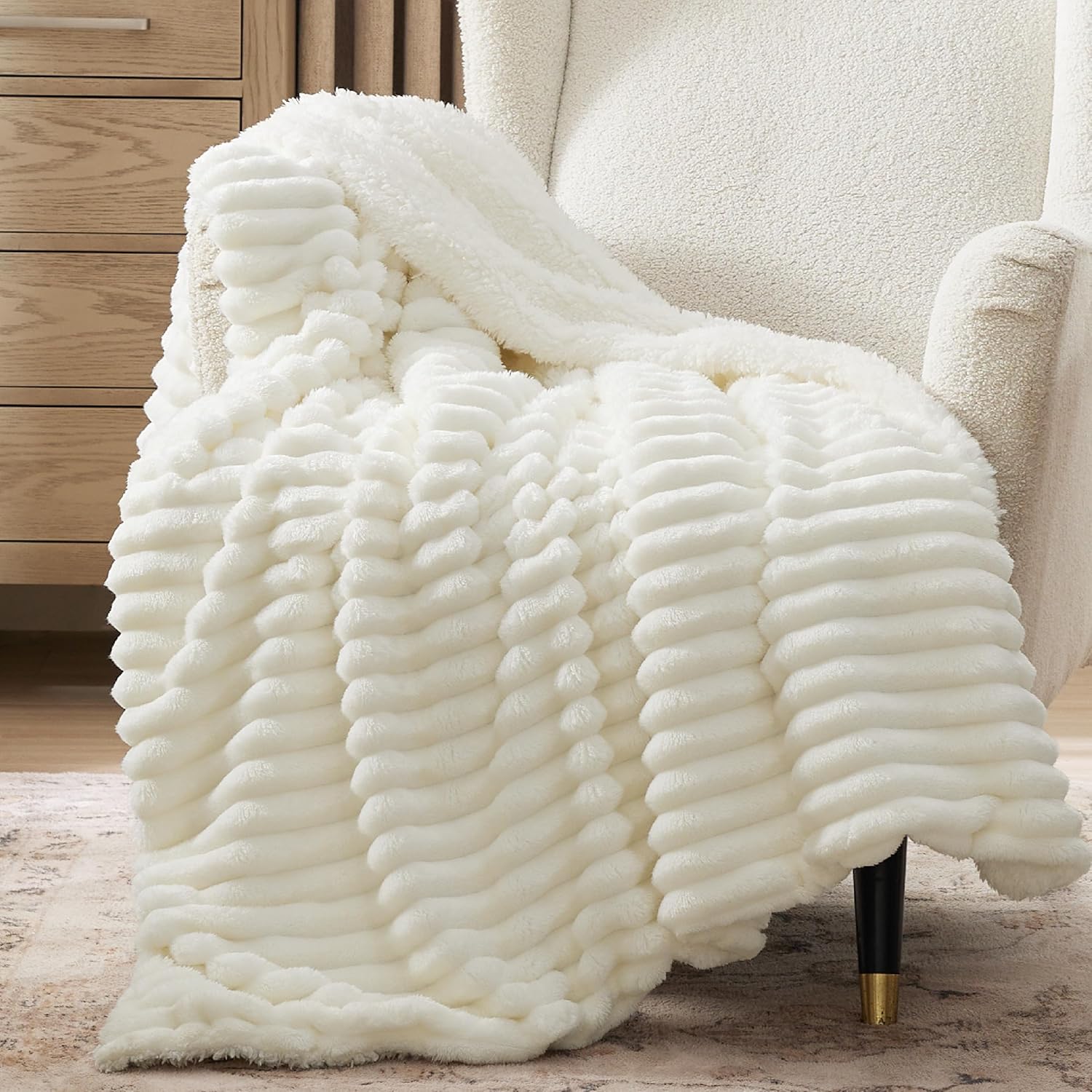 Verenza white sherpa throw blanket draped on sofa
